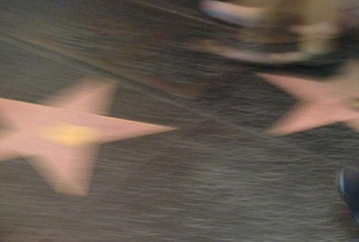 A motion-blurred photo of the Hollywood Stars on their famous sidewalk